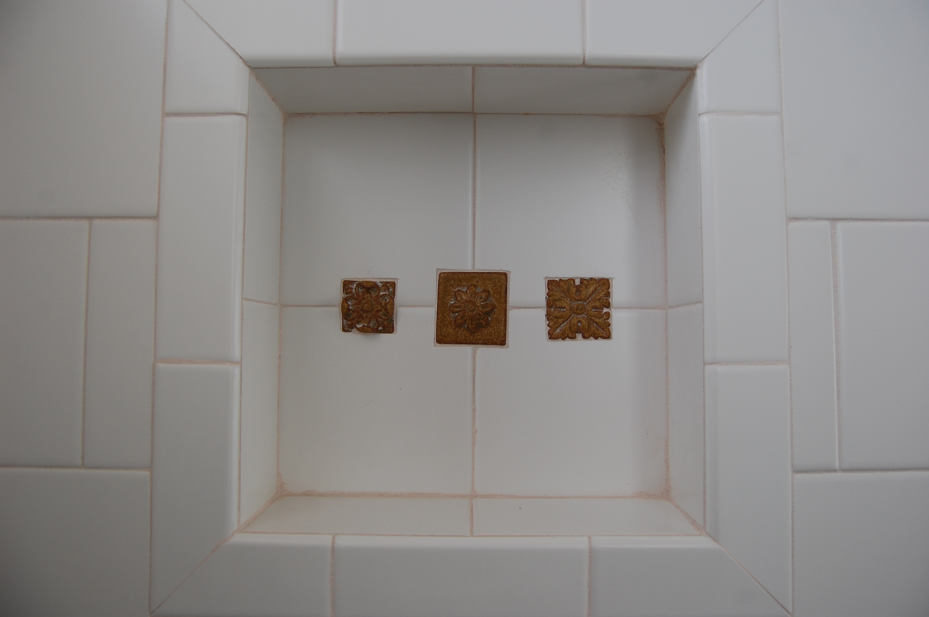 Accent tiles in shower niche